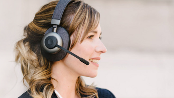 Profile view of a woman wearing a Tilde Pro headset