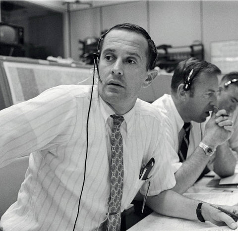 man wearing early plantronics office headset for nasa mission