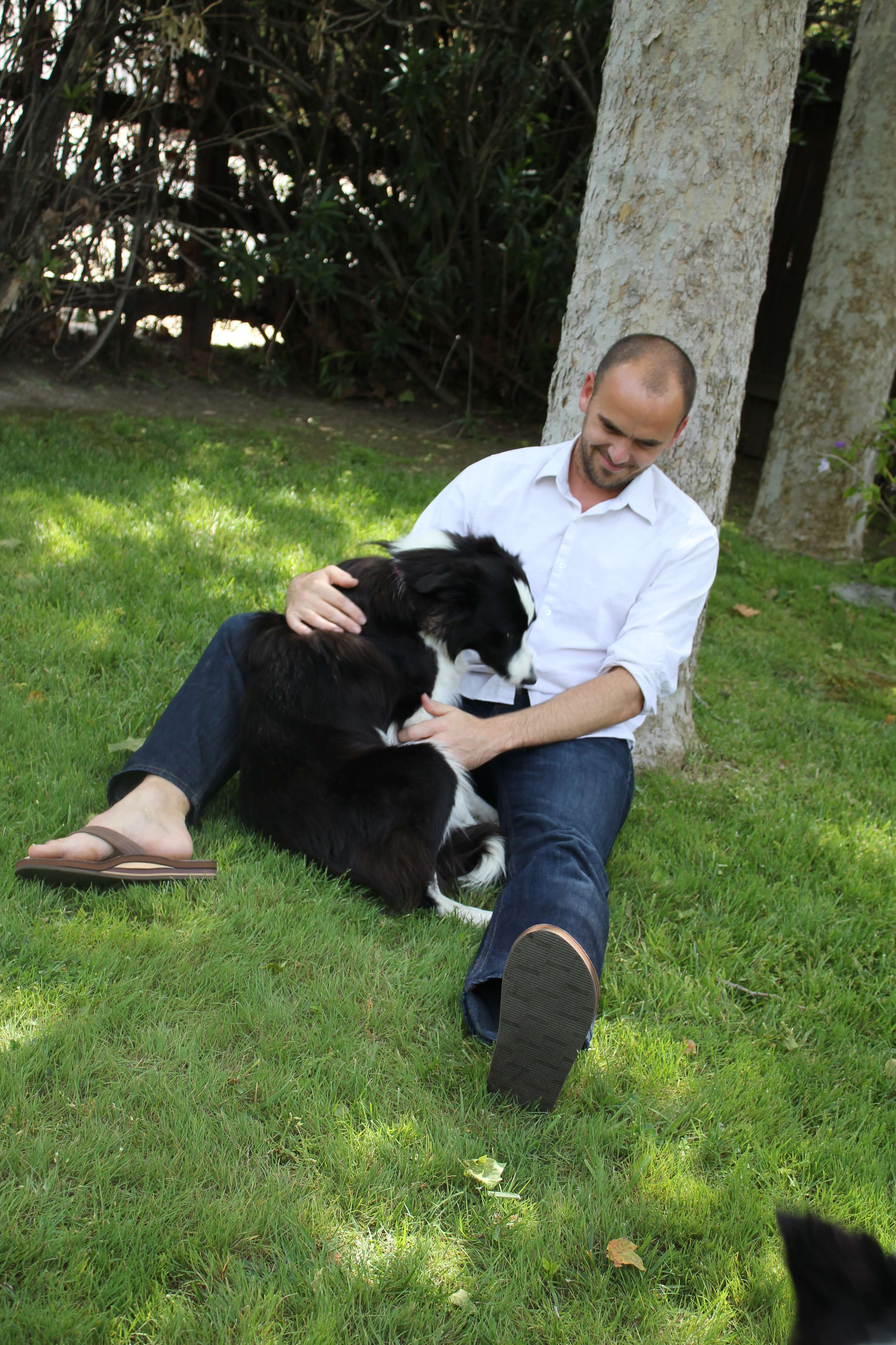 a man cuddling with his dog!