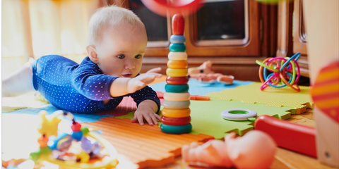 baby playing with sensory toys