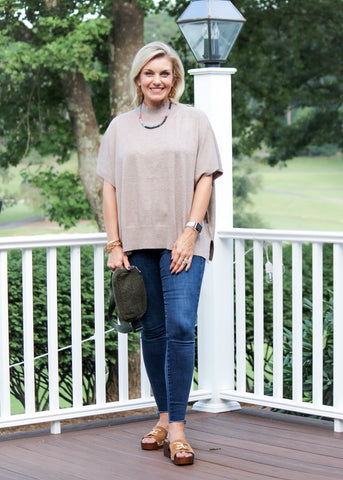Caroline Top in taupe on model on outdoor deck.