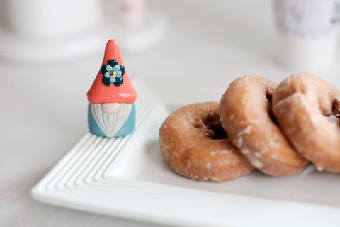 "Oh gnome you didn't" mini. Donut platter in background.