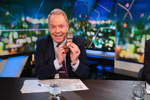 Peter Helliar holding Caringbah craft centre bot