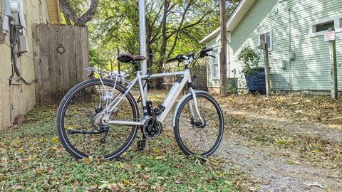 An e-bike locked up to a street sign in an alley adjacent to South Congress in Austin, TX. 