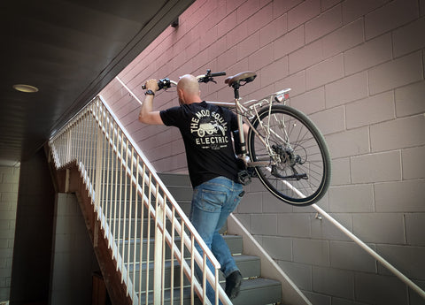 Carrying an electric bicycle up a set of stairs builds character and strength. Keeping your e-bike inside is much preferred for safe overnight storage.
