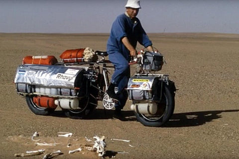 Jean Naud rides across the Sahara desert in 1986 on his custom fat bike.