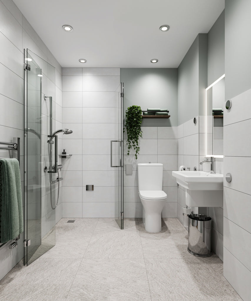  After. Modern light grey tiled accessible wetroom with shower enclosure doors open and folded flat against the walls