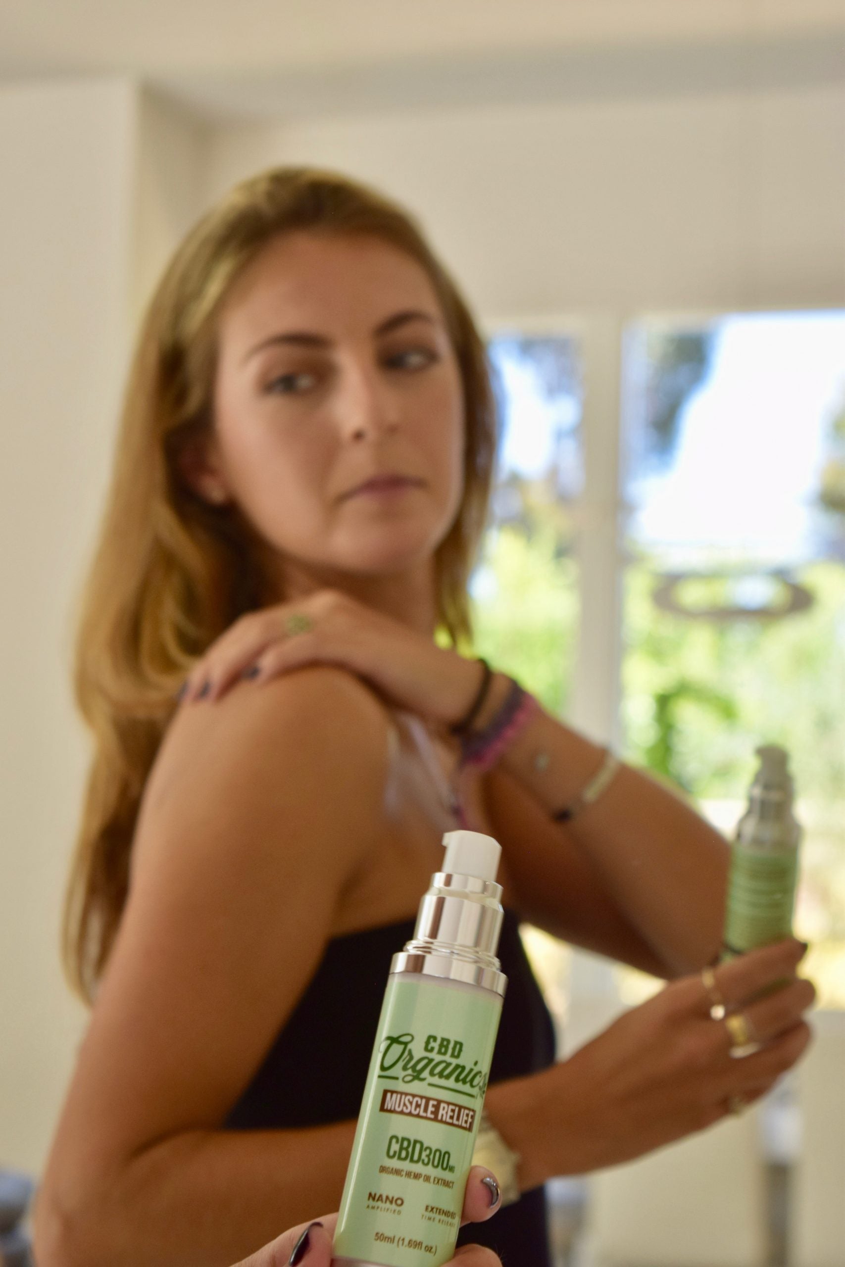 Woman putting on pain cream