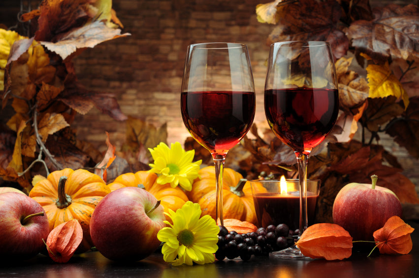 Glasses of red wine in a fall setting