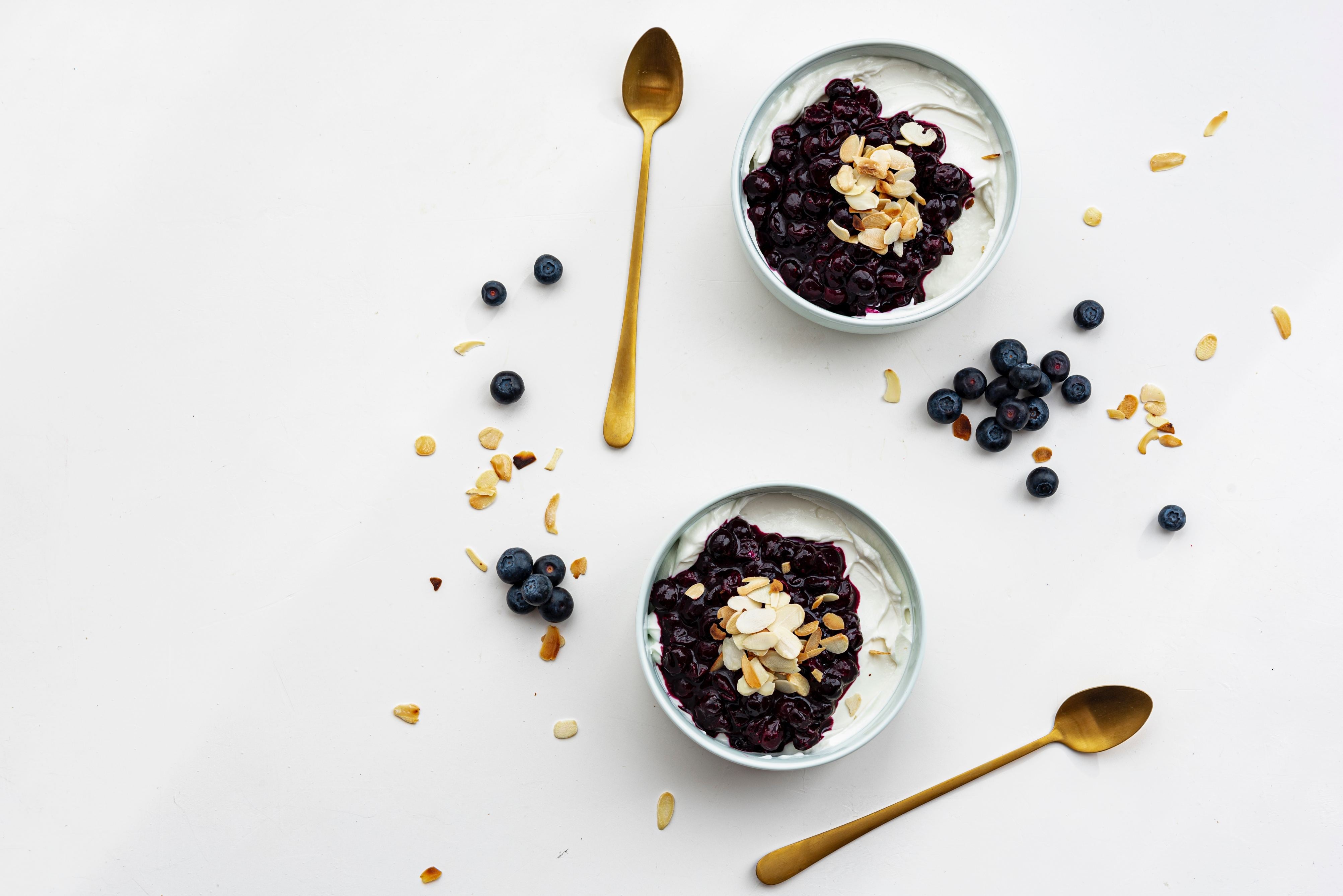 Yogurt and gold spoons