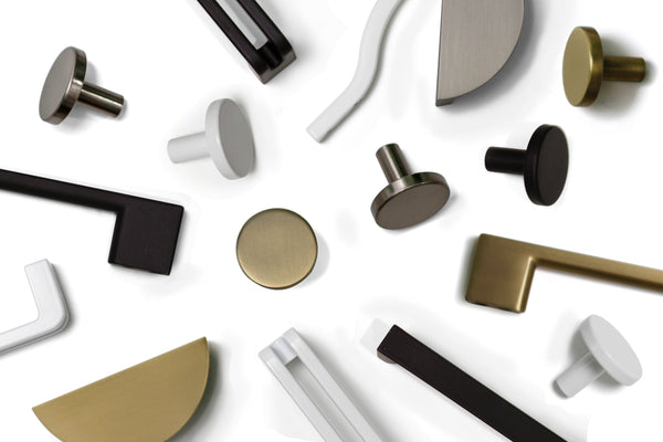 Flat lay image of contemporary style cabinet handles. Including Brass Handles, Black Handles, White Handles, Dull Brushed Nickel Handles