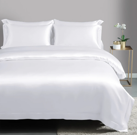 fully made white bed