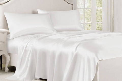 white bed with two pillows