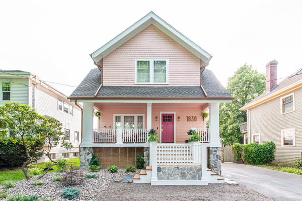 "After" photo of Rebekah Higgs' craftsman home, painted pink, with numbers from Modern House Numbers