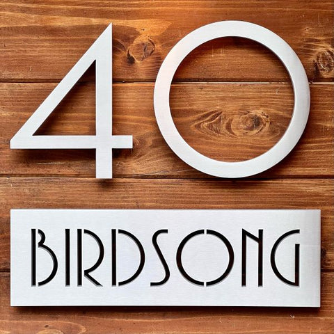 Modern House Numbers 40 Palm springs font above aluminum plaque sign, Birdsong in socal font, on wood siding