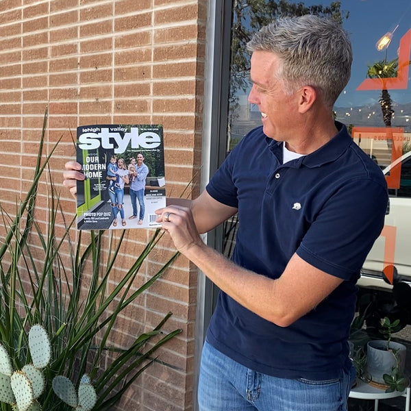 Rick McLain of Modern House Numbers shows of the September issue of Lehigh Valley Style Magazine at MHN HQ in Tucson Arizona