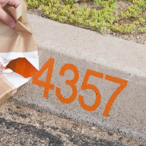 Modern curb numbers using a vinyl curb stencil decal from Modern House Numbers