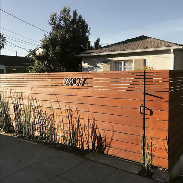 Modern House Numbers 8" Palm Springs numbers, Brushed Aluminum, installed on a stained wood fence