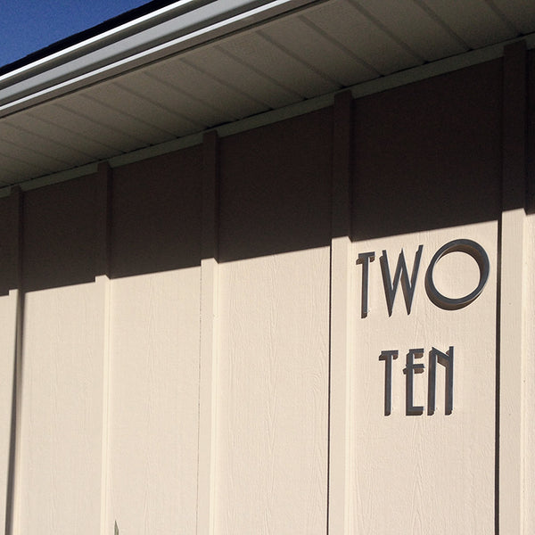 SoCal Uppercase Letters, Brushed Aluminum finish, Installed On A  Painted Wood Siding