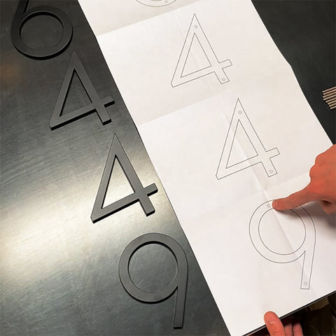 A helpful paper drilling template from Modern House Numbers makes for a worry-free installation