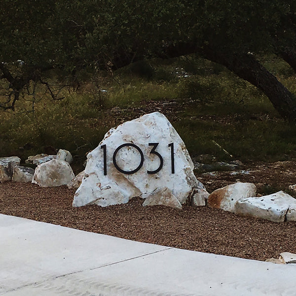 Matte Black SoCal Numbers '1031' Installed on a boulder near a driveway, Modern House Numbers