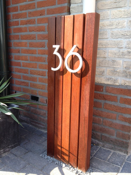 12" Palm Springs numbers in Brushed Aluminum installed on a vertically oriented wood monument - Modern House Numers