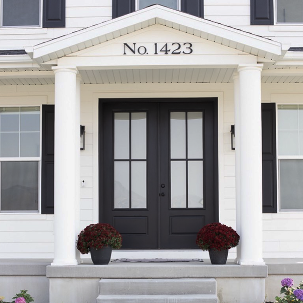 Modern House Numbers and Letters, Santa Barbara font, Matte Black finish installed on a two-story traditional white home. Photo and design by Lindsay Hill Interiors