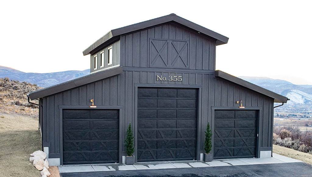 Modern House Numbers and Letters, Santa Barbara font, Matte Black finish installed on a two-story traditional white home. Photo and design by Lindsay Hill Interiors
