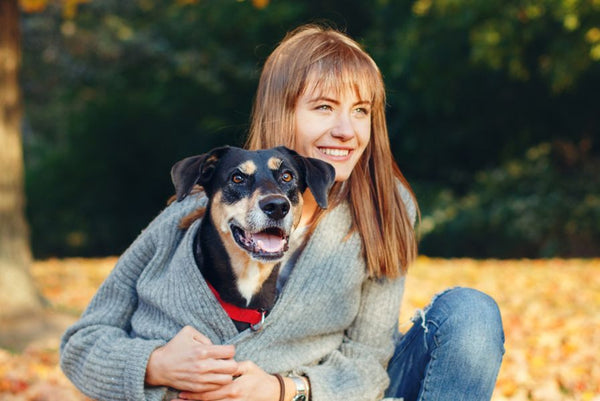 woman hugging dog