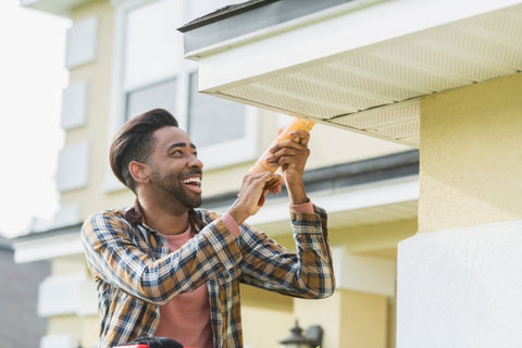 young man doing home repair