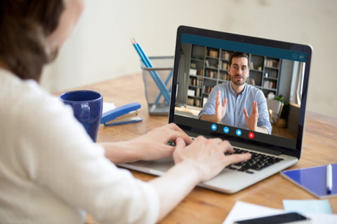 woman watching a video on a laptop