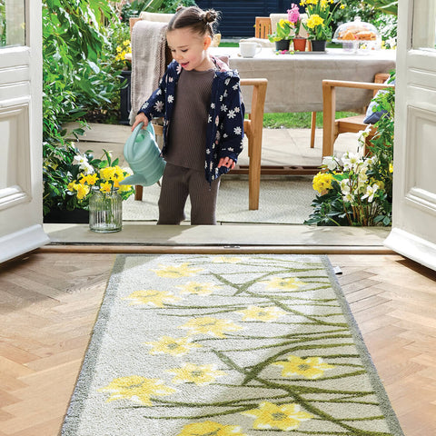 Girl watering Daffodil Hug Rug Design