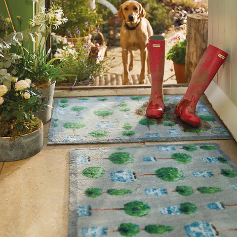 Dog At The Front Door With Topiary Hug Rug
