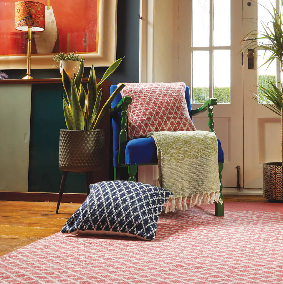 Woven cushions and throws on a chair in a living room