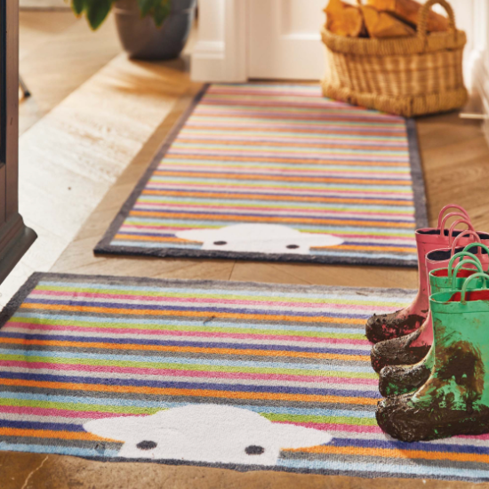 A matching stripy door mat and runner in a hallway featuring a sheep