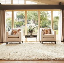 A white wool rug in a living room