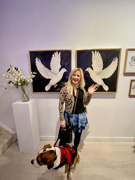 At the Untitled Space Gallery with my watercolor Doves and my dog Davis in January of 2020