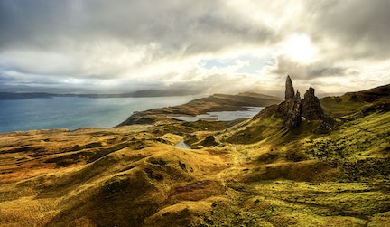 Grassy mountains and ocean in Scotland