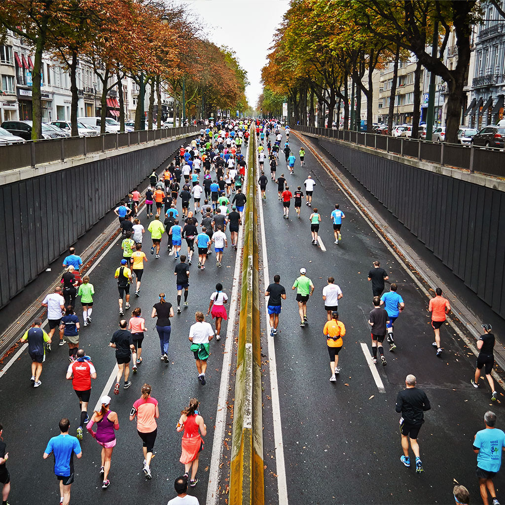 People running through city