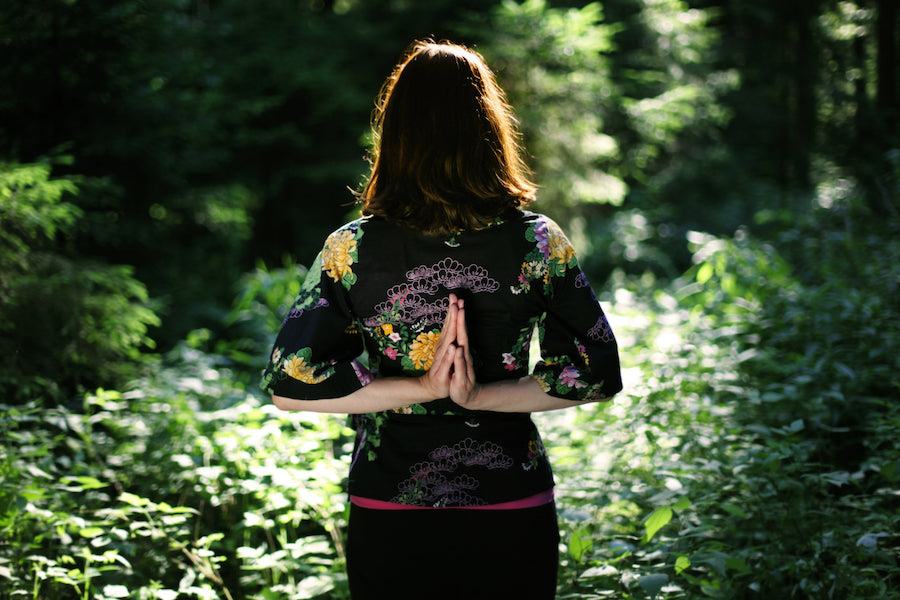 woman yoga forest stress relief