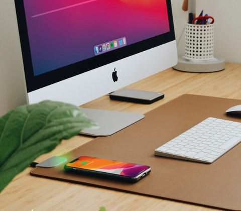 This wireless charging desk mat keeps your EDC gadgets charged