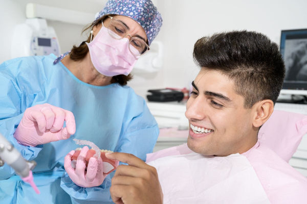 man getting invisalign braces