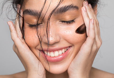 Model with charcoal face mask.