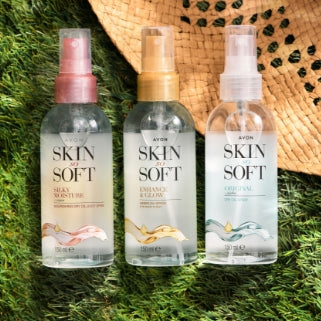 Three Original Skin So Soft bottles on a grass background.