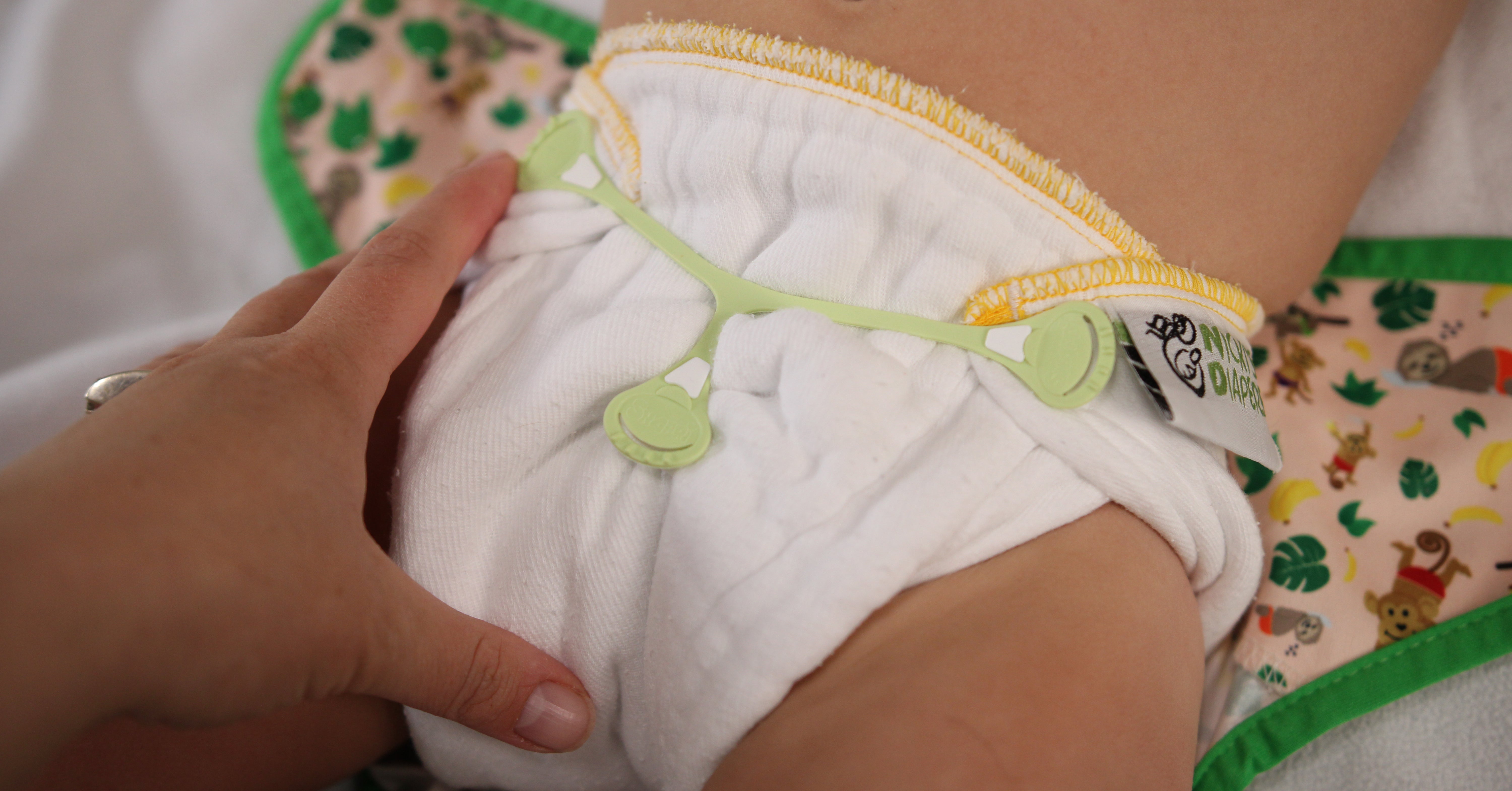 prefold cloth diaper with a snappi