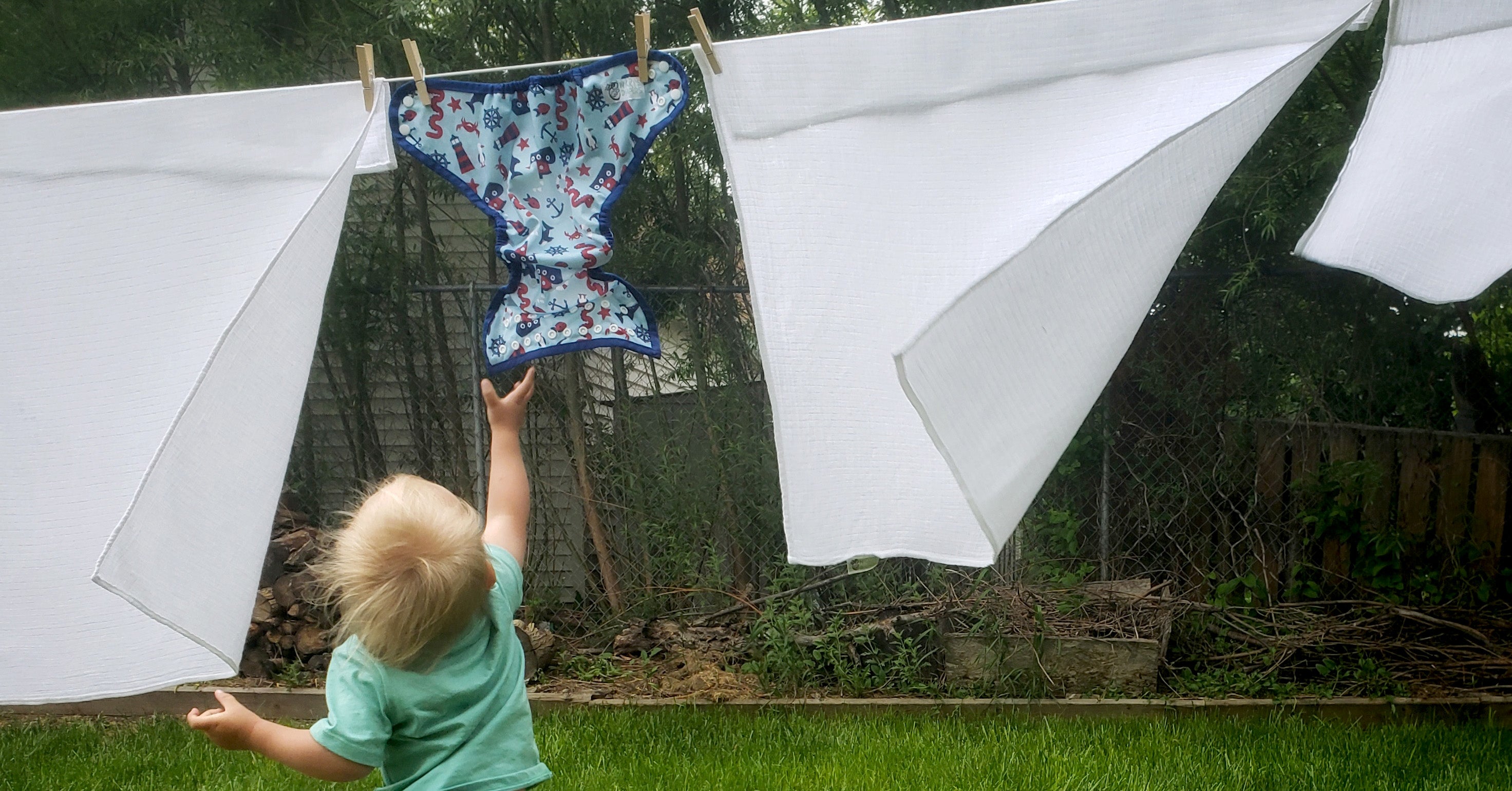 kids helping do the laundry with cloth diapers