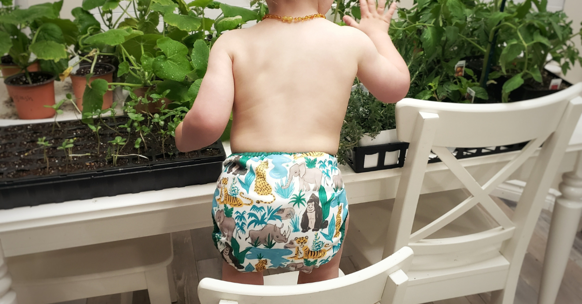 a kid is wearing a cloth diaper