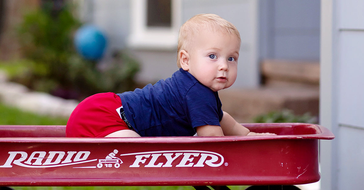 baby wearing a cloth diaper outside