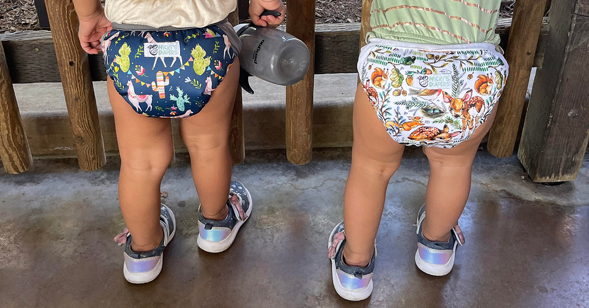 2 toddlers in cloth diapers