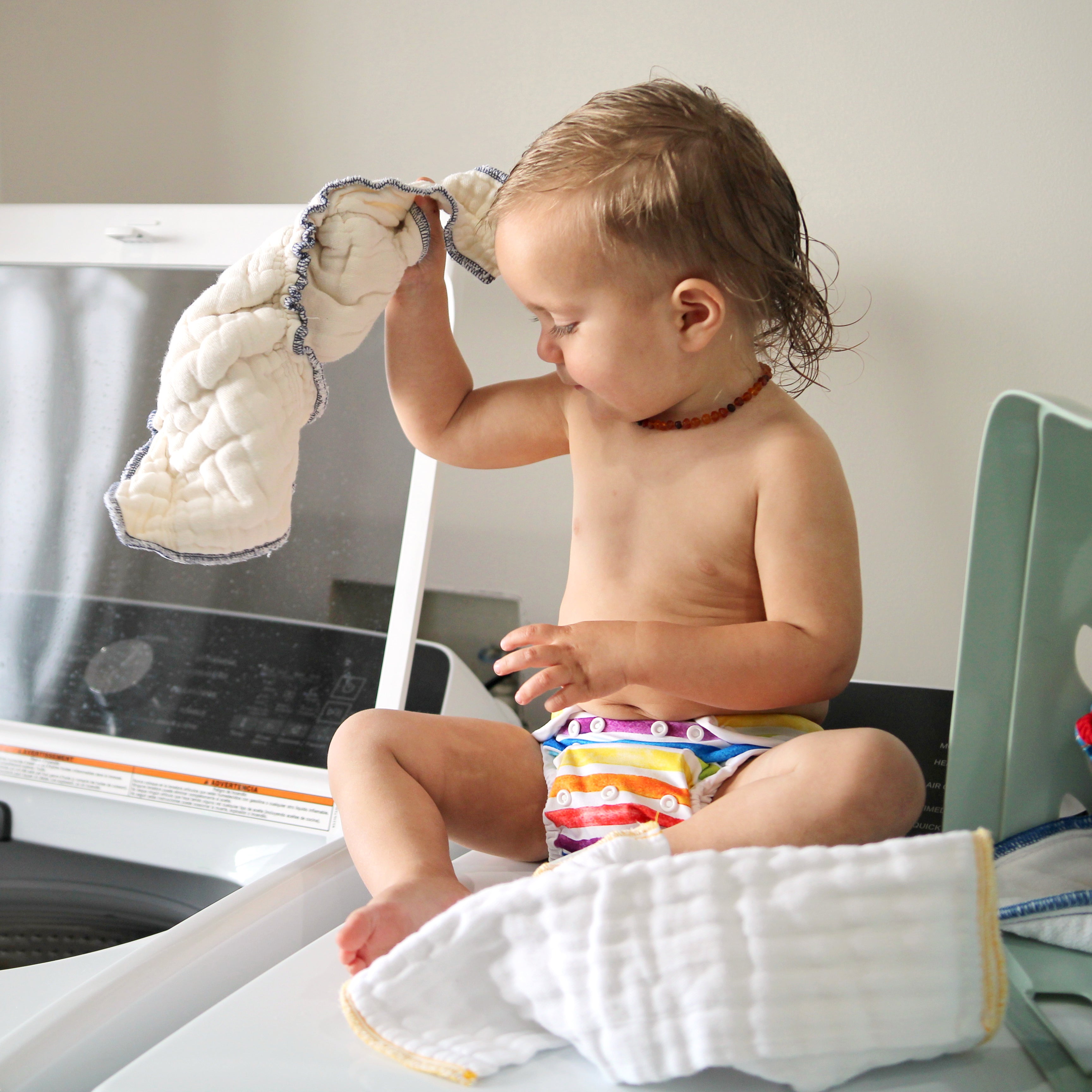 baby learning how to wash cloth diapers